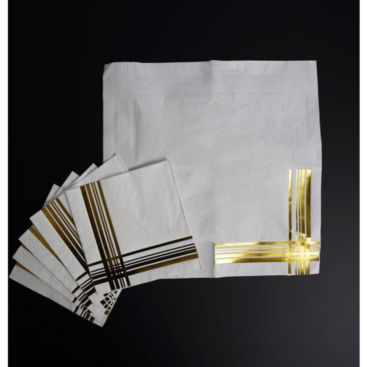 Custom 3 ply napkins in white with gold foil stripes, featuring a logo and a larger matching napkin.