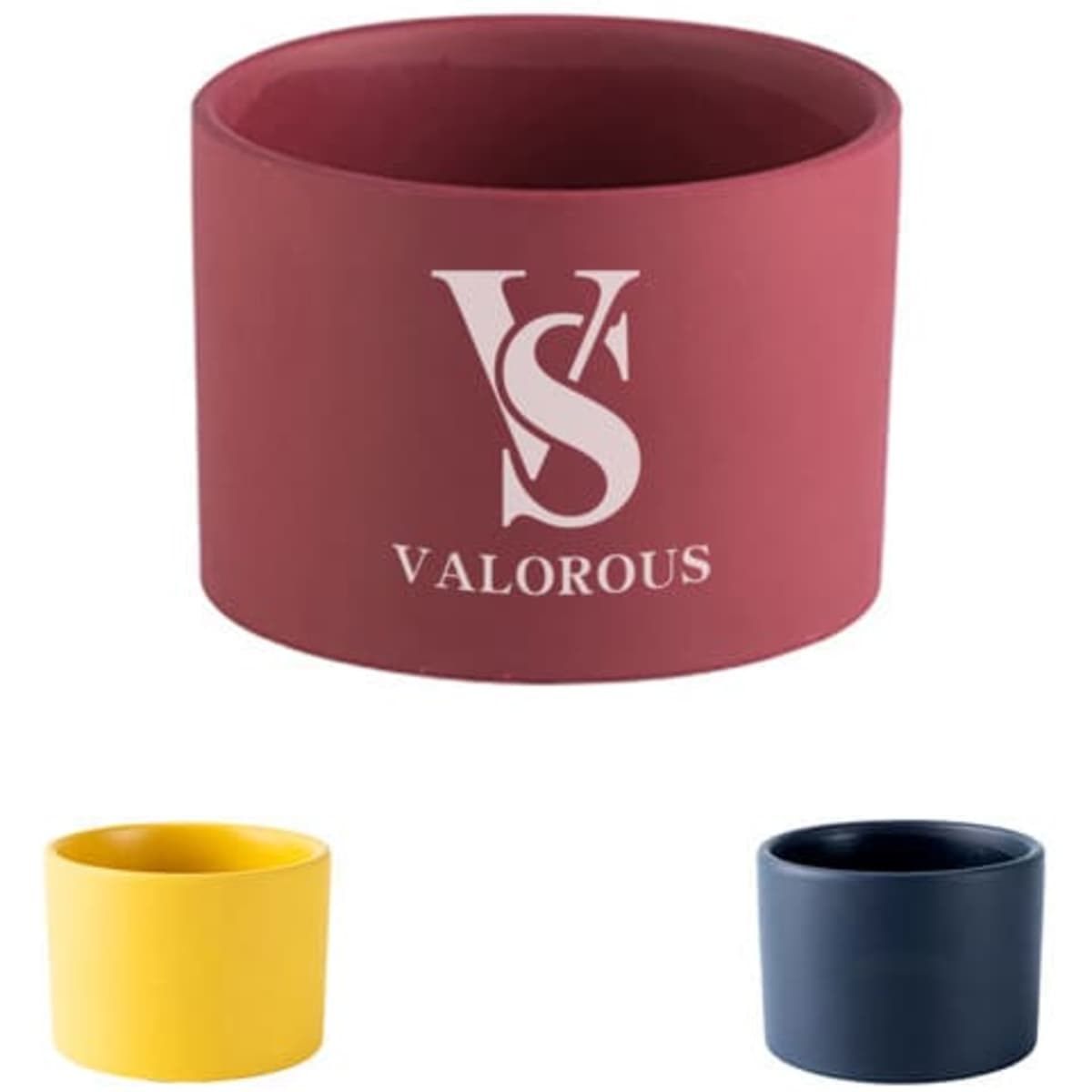 A set of three mini succulent pots in maroon, yellow, and navy blue, featuring a logo on the maroon pot.