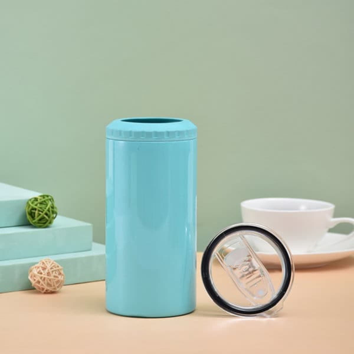 A drink bottle in a vibrant turquoise colour with a clear lid, featuring a logo and a sleek design.