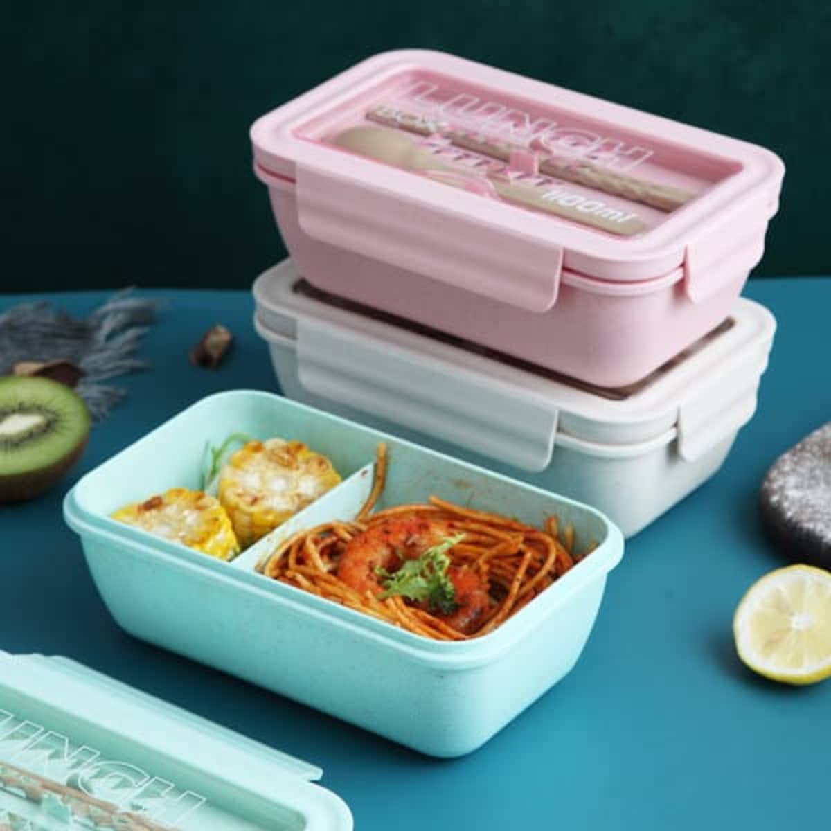 A pastel-coloured bento box set in pink, blue, and white, with tableware included inside each box.