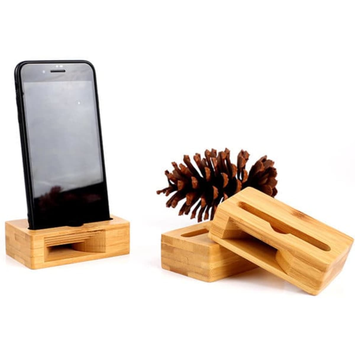 A wooden phone amplifier stand in light brown, featuring a smartphone holder and a pine cone.