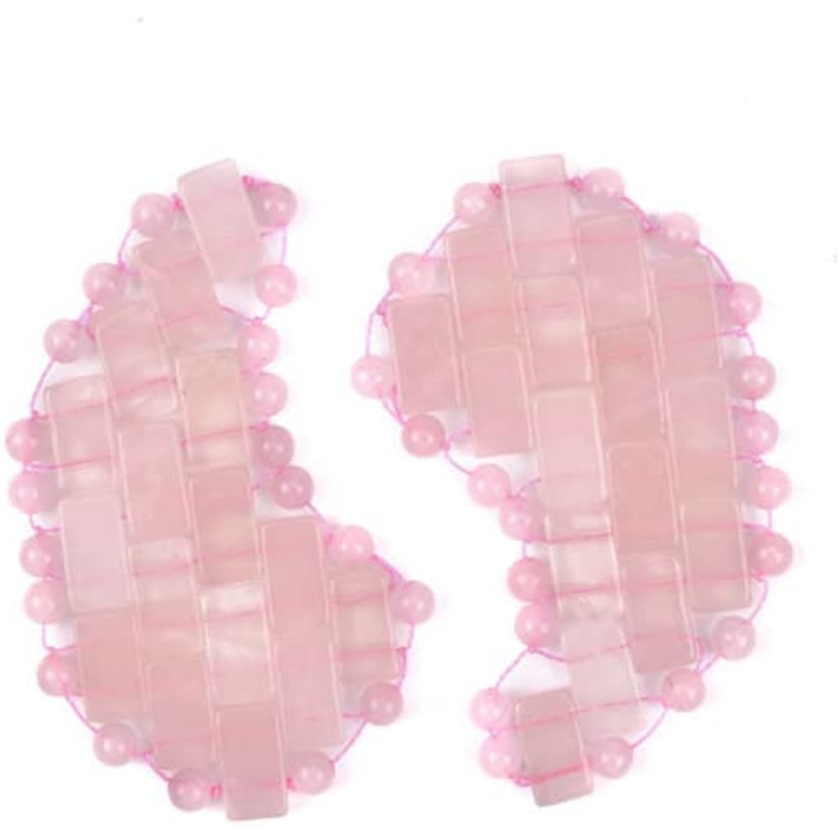Rose quartz eye patches in soft pink hues, featuring a textured design of beads and geometric shapes.