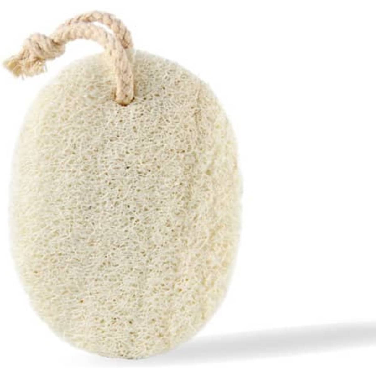 A natural loofah sponge in a beige colour with a rope attached for hanging.