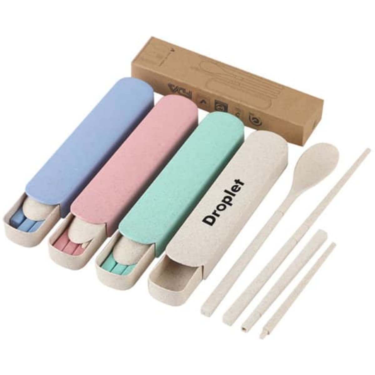 A set of wheat straw travel cutlery in pastel colours, including two utensils and a spoon in a matching case.