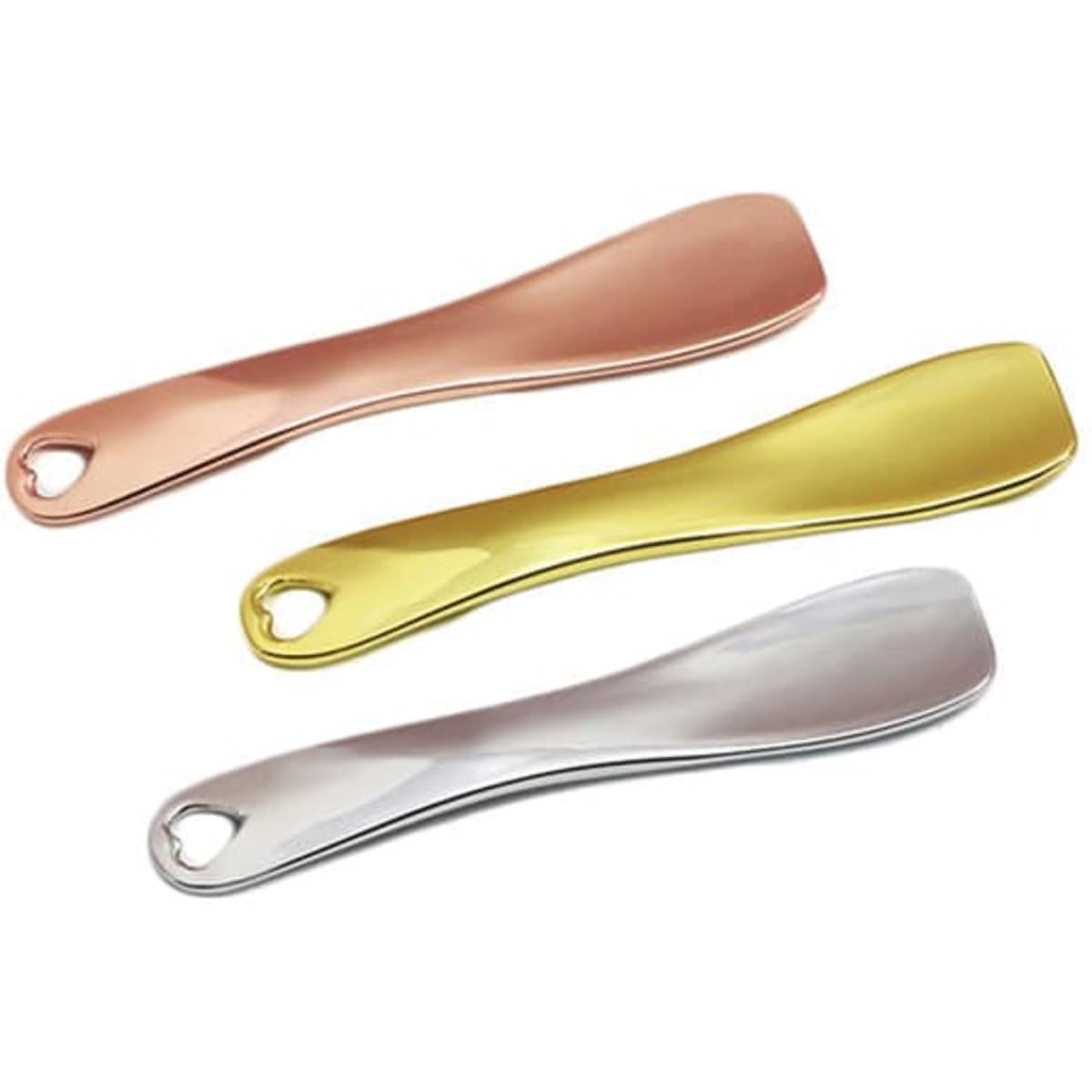Three metal cosmetic spatulas in rose gold, gold, and silver, featuring a small hole at the handle for hanging.