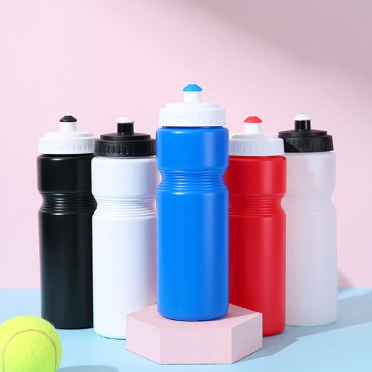 A drink bottle collection featuring black, white, blue, red, and pink colours, each with a white or black cap and logo.