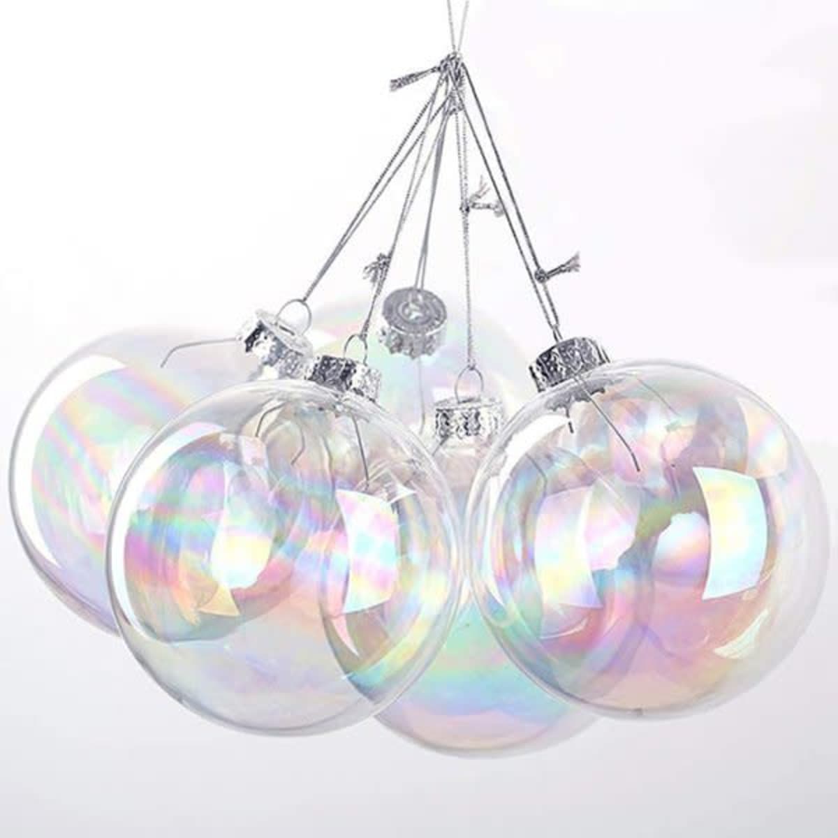 Multiple clear glass ornaments with a rainbow iridescent finish, each featuring a silver cap and hanging string.