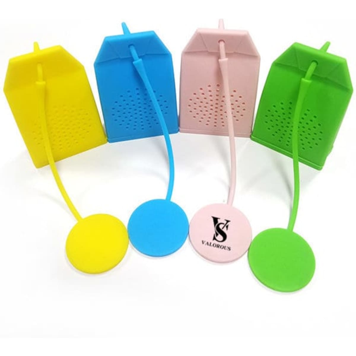 A collection of silicone tea infuser strainers in yellow, pink, green, and blue, featuring a tea bag shape and a round base.