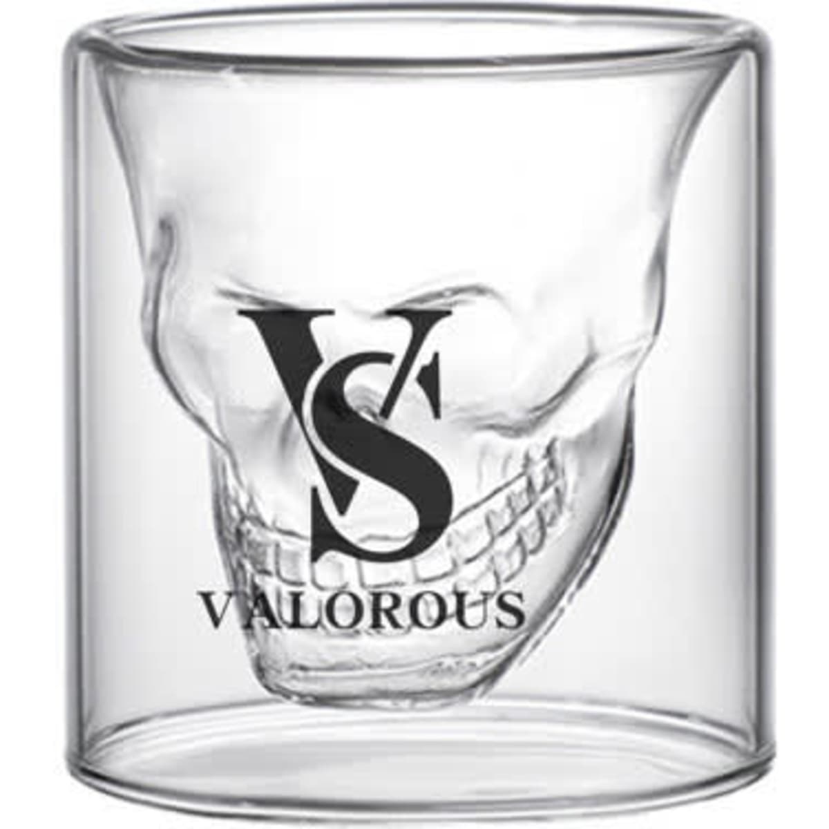 A glass skull cup with a double wall design, featuring a logo in black. The cup is clear and stylish.