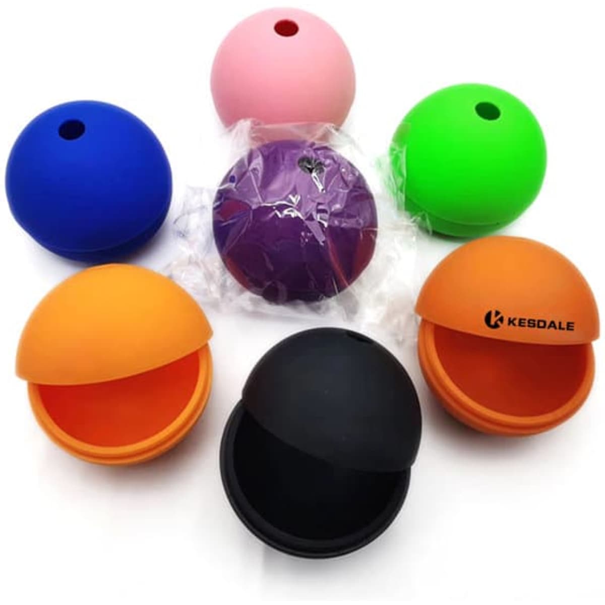 A collection of silicone ice ball maker molds in blue, pink, green, orange, black, and purple, with one wrapped in plastic.