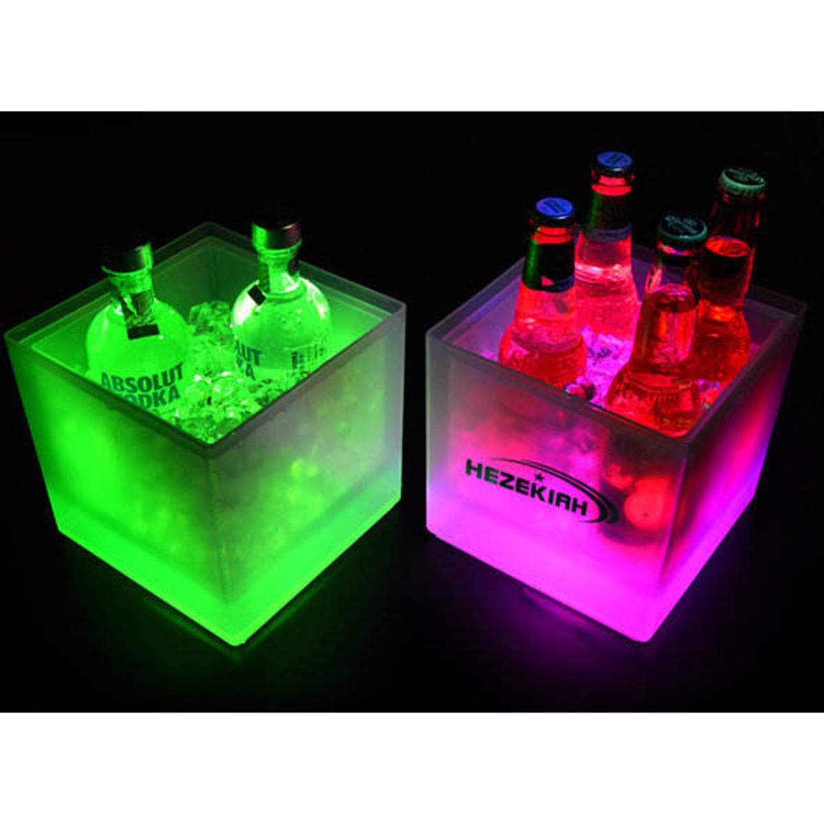 A colourful LED ice bucket containing bottles, illuminated in green and pink, with ice and some drinks visible.