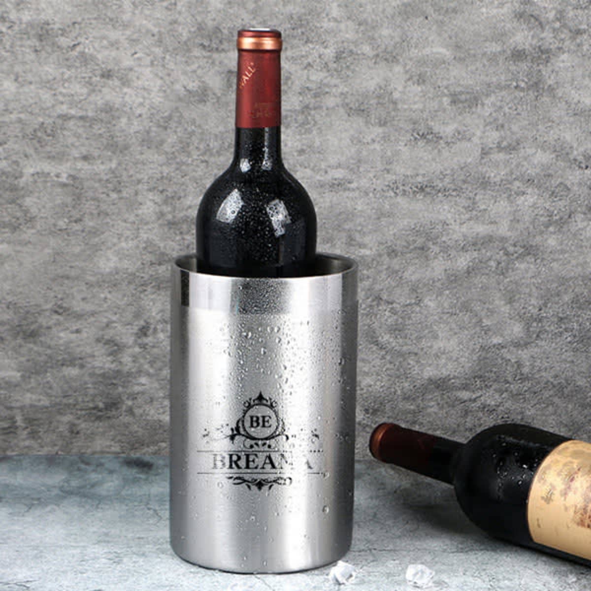 A stainless steel chiller bucket with a wine bottle inside, featuring a logo and water droplets on its surface.