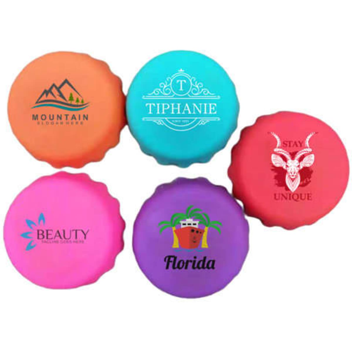 A set of five silicone beer bottle caps in vibrant colours: orange, turquoise, pink, purple, and magenta, featuring various logos.