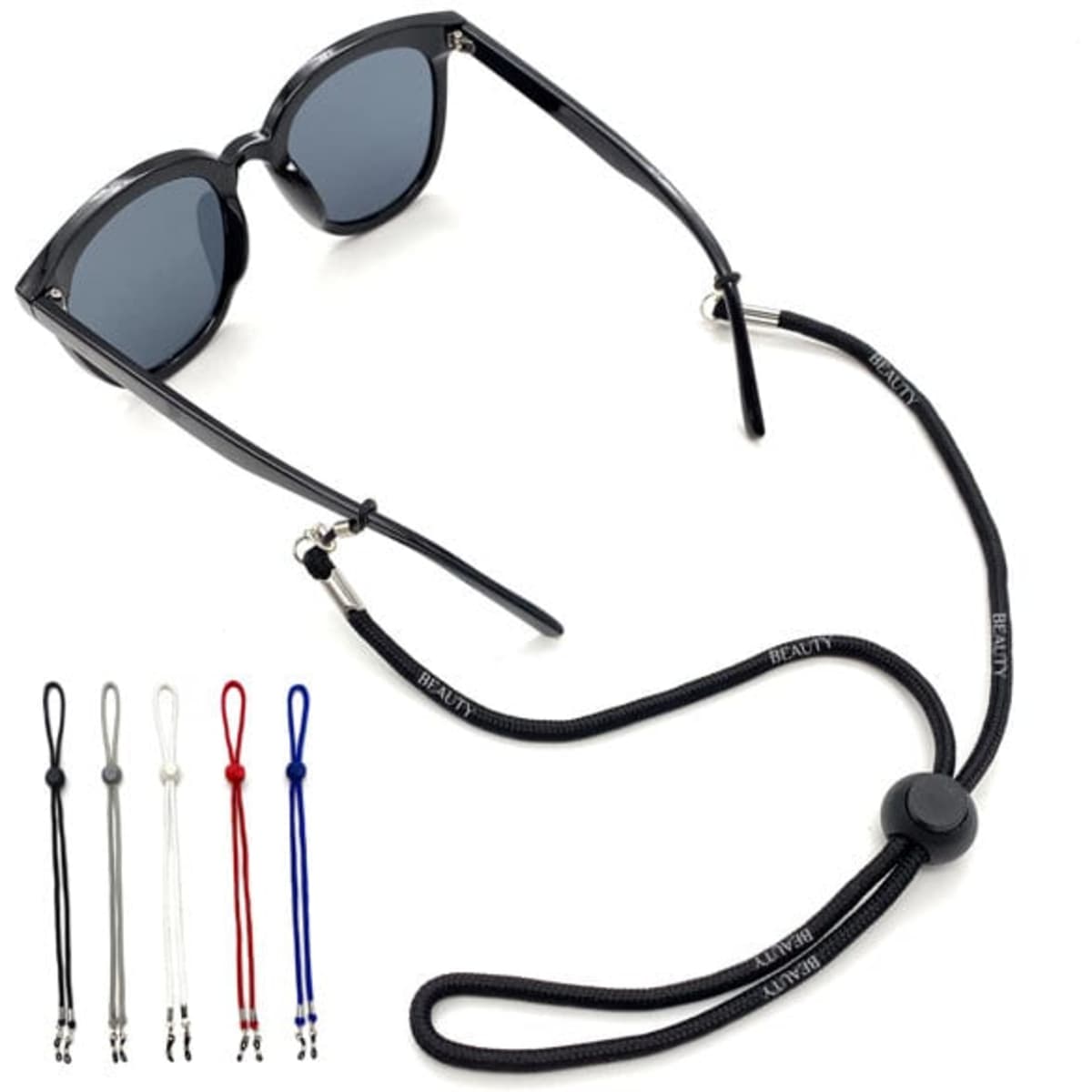 A black eyeglasses cord with adjustable ends, accompanied by five colourful alternative options in red, white, blue, and grey.