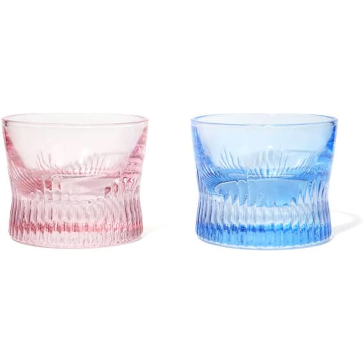 A set of two crystal whiskey corset glasses, one in pink and one in blue, featuring intricate textured designs.
