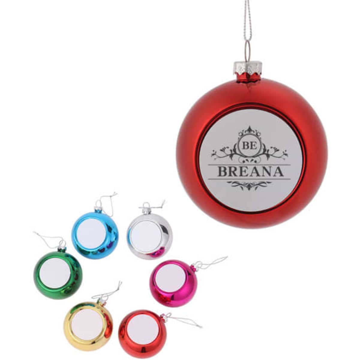 A red Christmas ball ornament with a silver cap, alongside six smaller, colourful ornaments in blue, green, silver, pink, and gold.