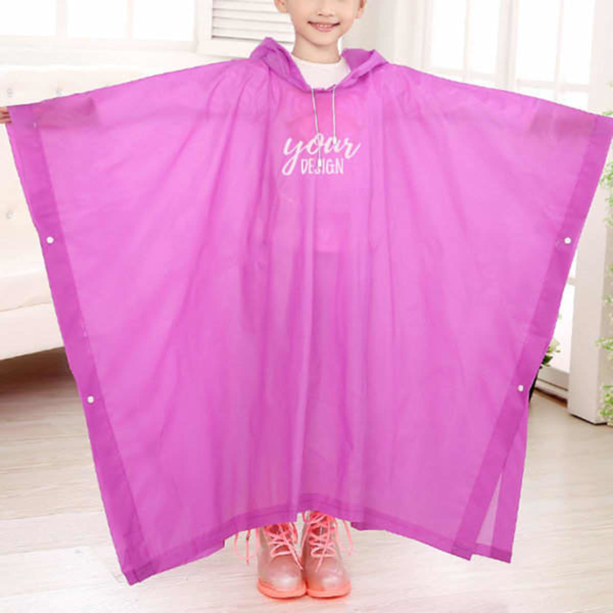 A children’s rain poncho in bright pink, featuring a hood and a logo, designed with snap closures on the sides.