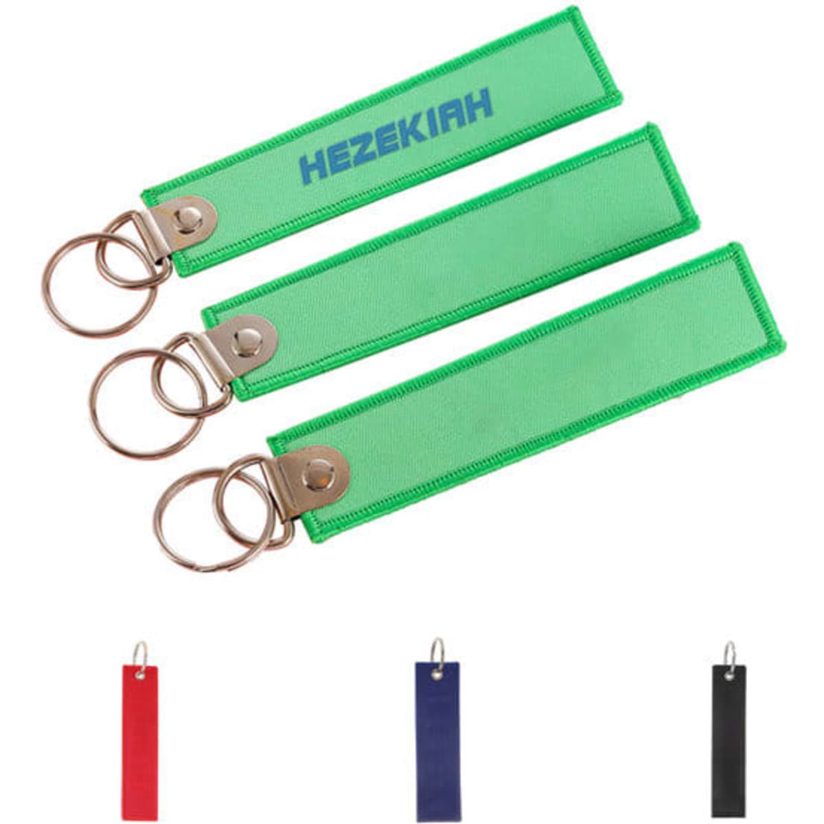 A set of three custom embroidered airplane key tags in green, red, and black with metal key rings.