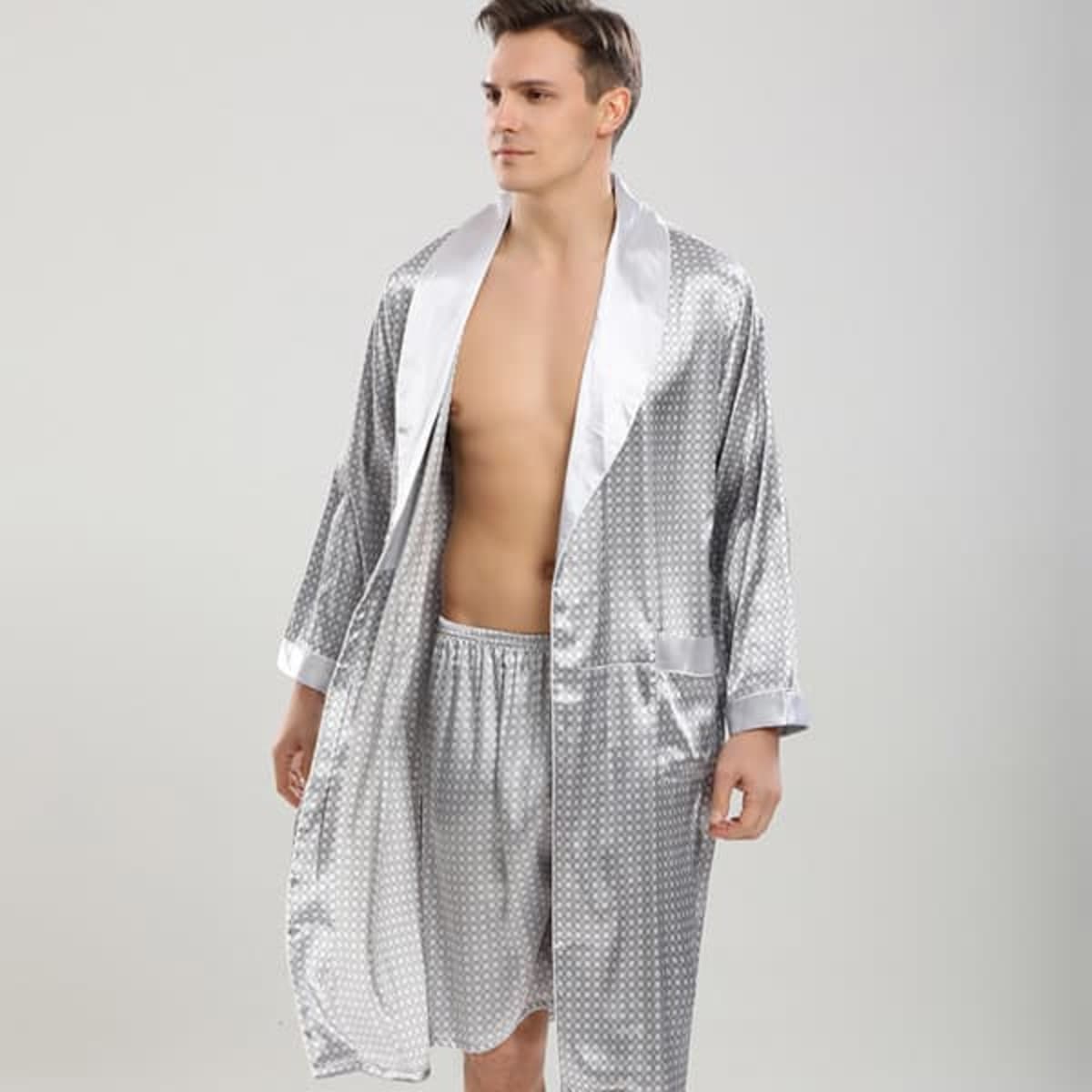 A men's silk robe in silver with a polka dot pattern, featuring a contrasting satin collar and long sleeves.