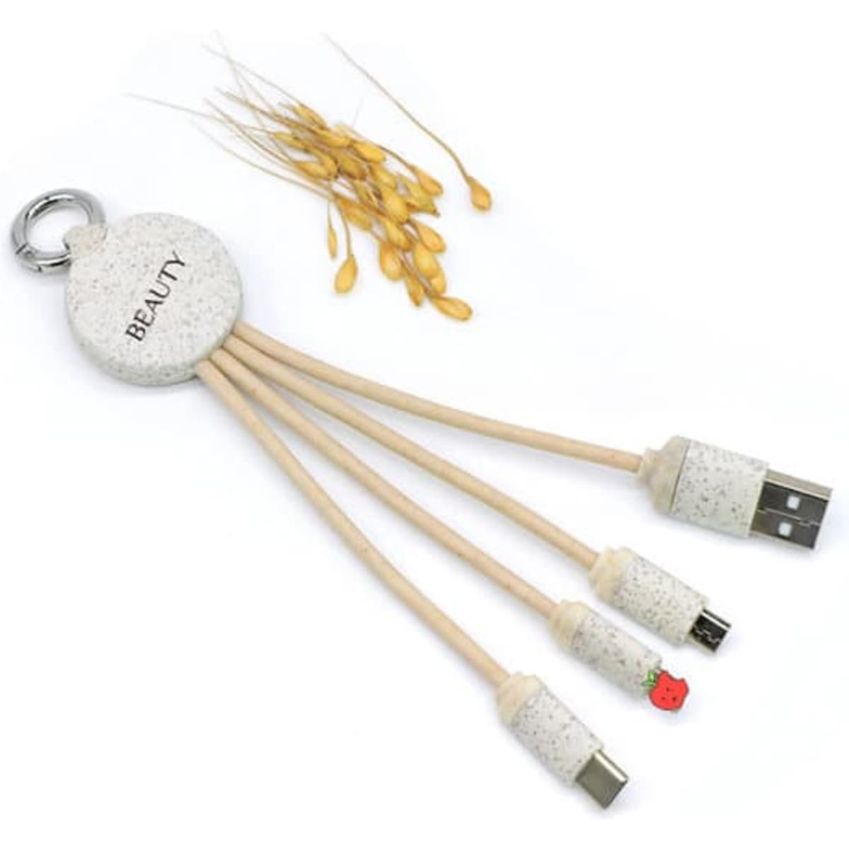 A wheat straw charging cable in beige with a keychain, featuring three different connections and a small logo.