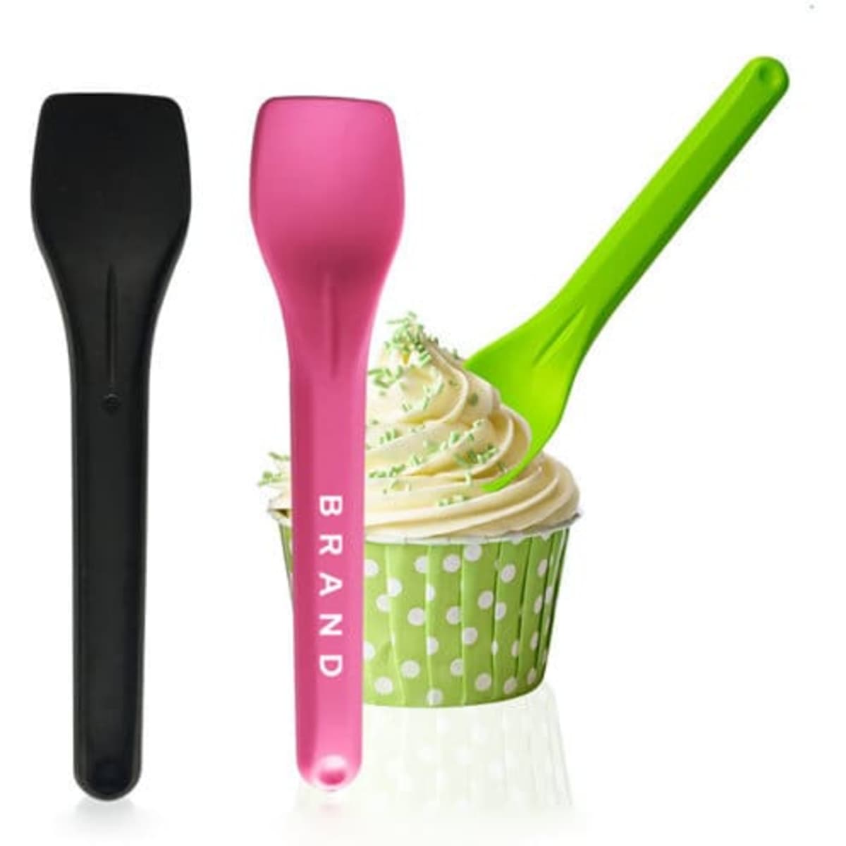Two biodegradable dessert spoons in black and pink, alongside a cupcake with green frosting in a polka dot wrapper.