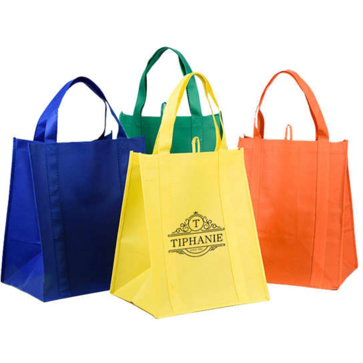 A set of four RPET non-woven shopping tote bags in blue, green, yellow, and orange, featuring a logo on one bag.