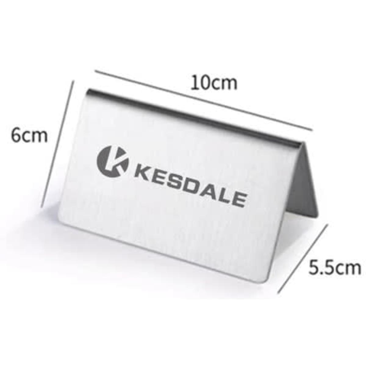 A stainless steel table sign with a sleek, polished finish, featuring a logo, measuring 10 cm by 6 cm.