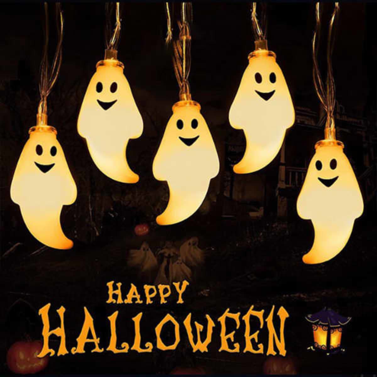 A string of spooky LED lights shaped like white ghosts, illuminated against a dark background with Halloween motifs.