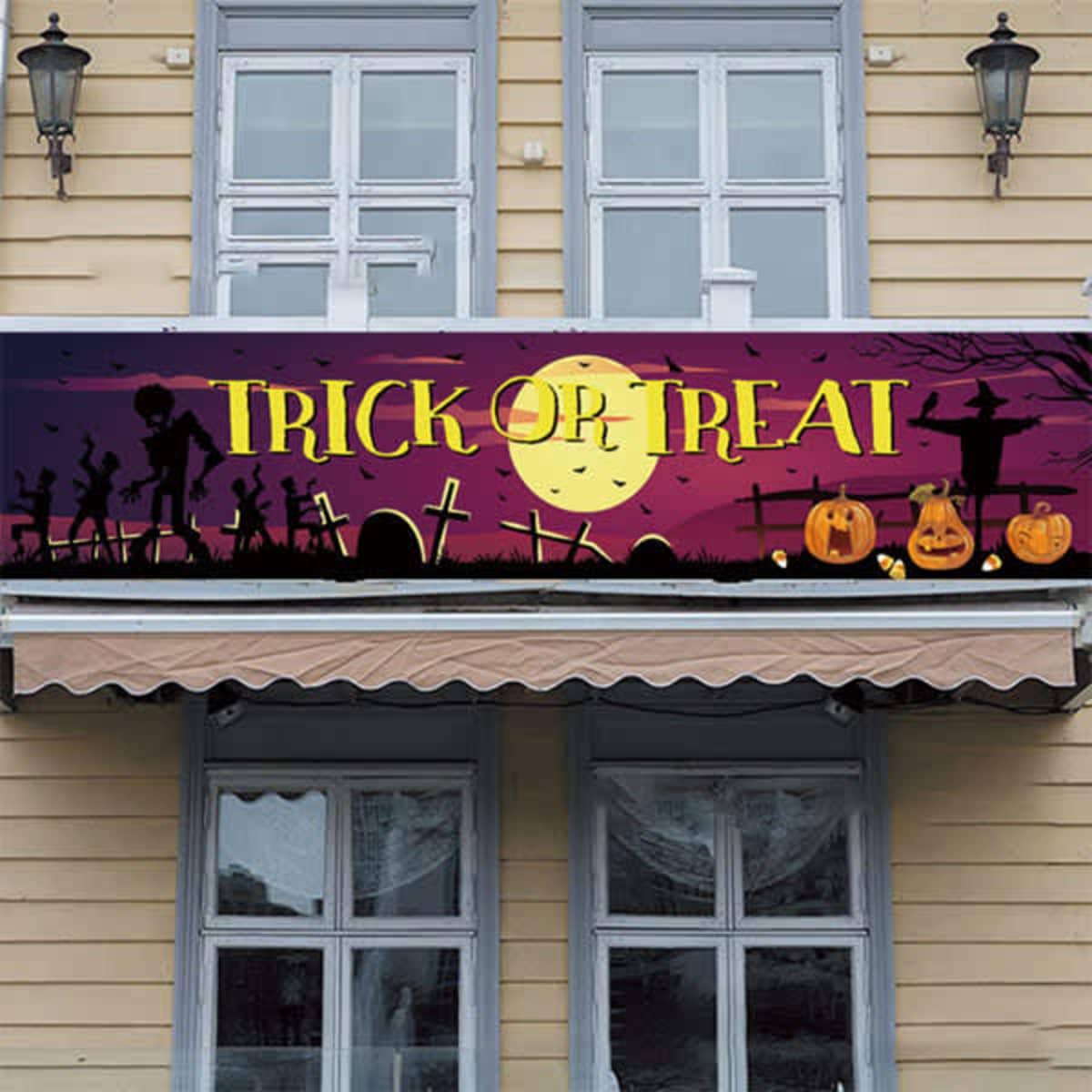 A custom Halloween banner featuring a spooky graveyard scene with pumpkins, ghosts, and a full moon, in purple and black.
