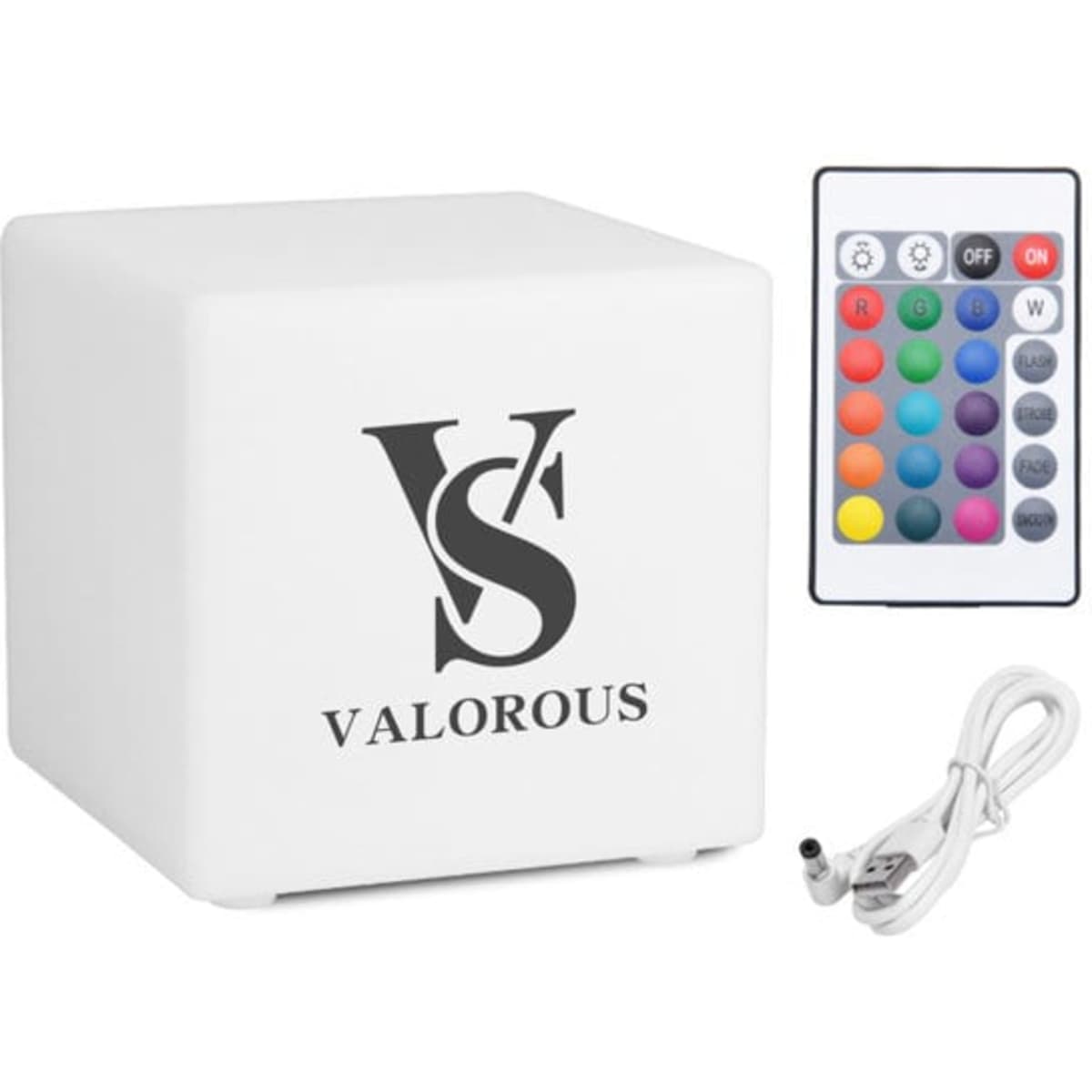 A large white colour cube with a logo, accompanied by a remote control and a charging cable.