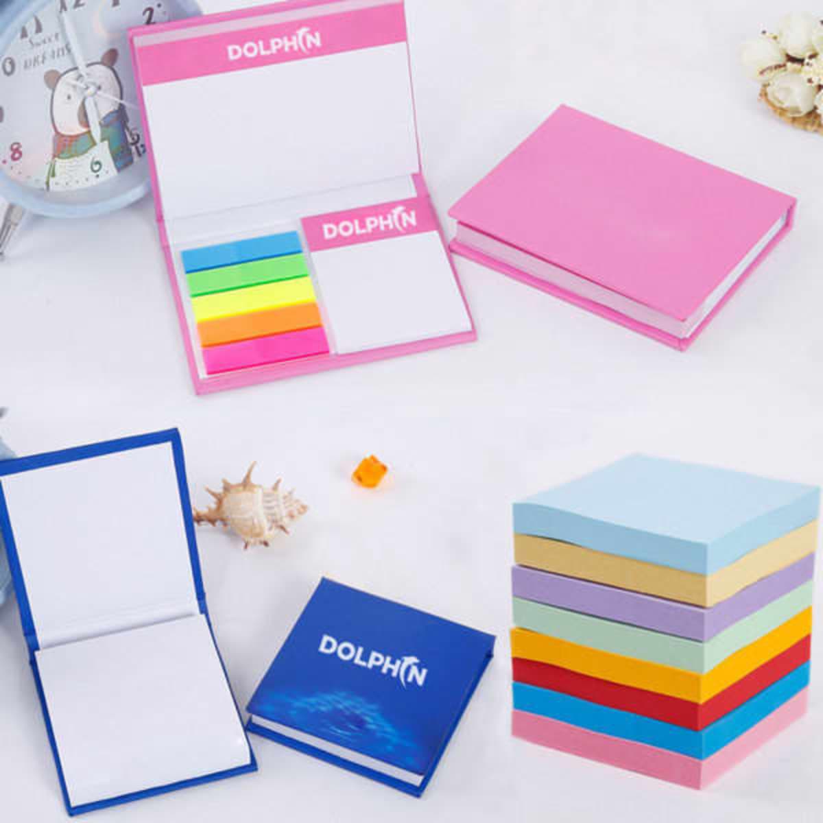 A set of sticky note memo pads in pink, blue, and pastel colours, featuring a branding logo on some pads.