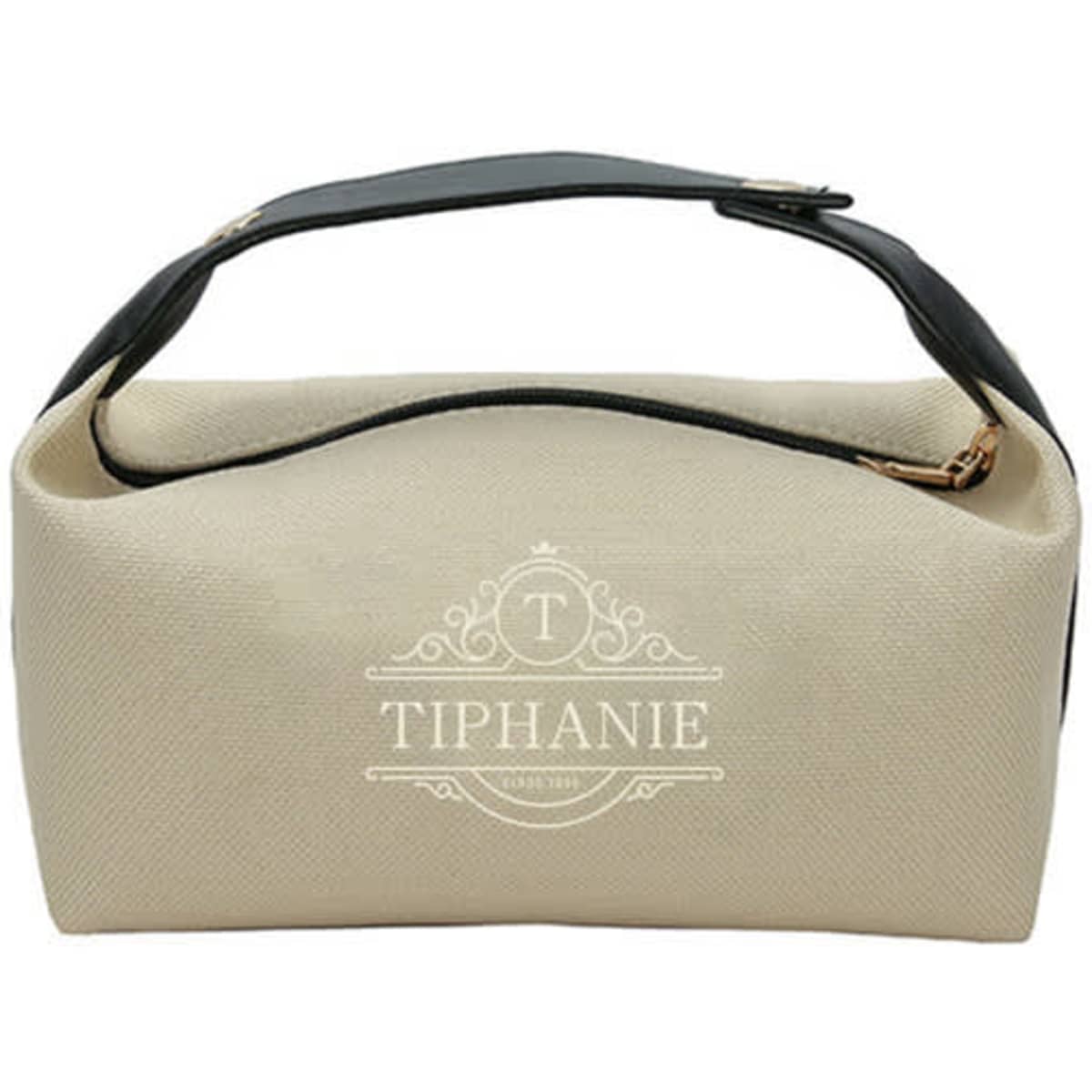 A portable toiletry storage bag in cream and black, featuring a top handle and a logo.