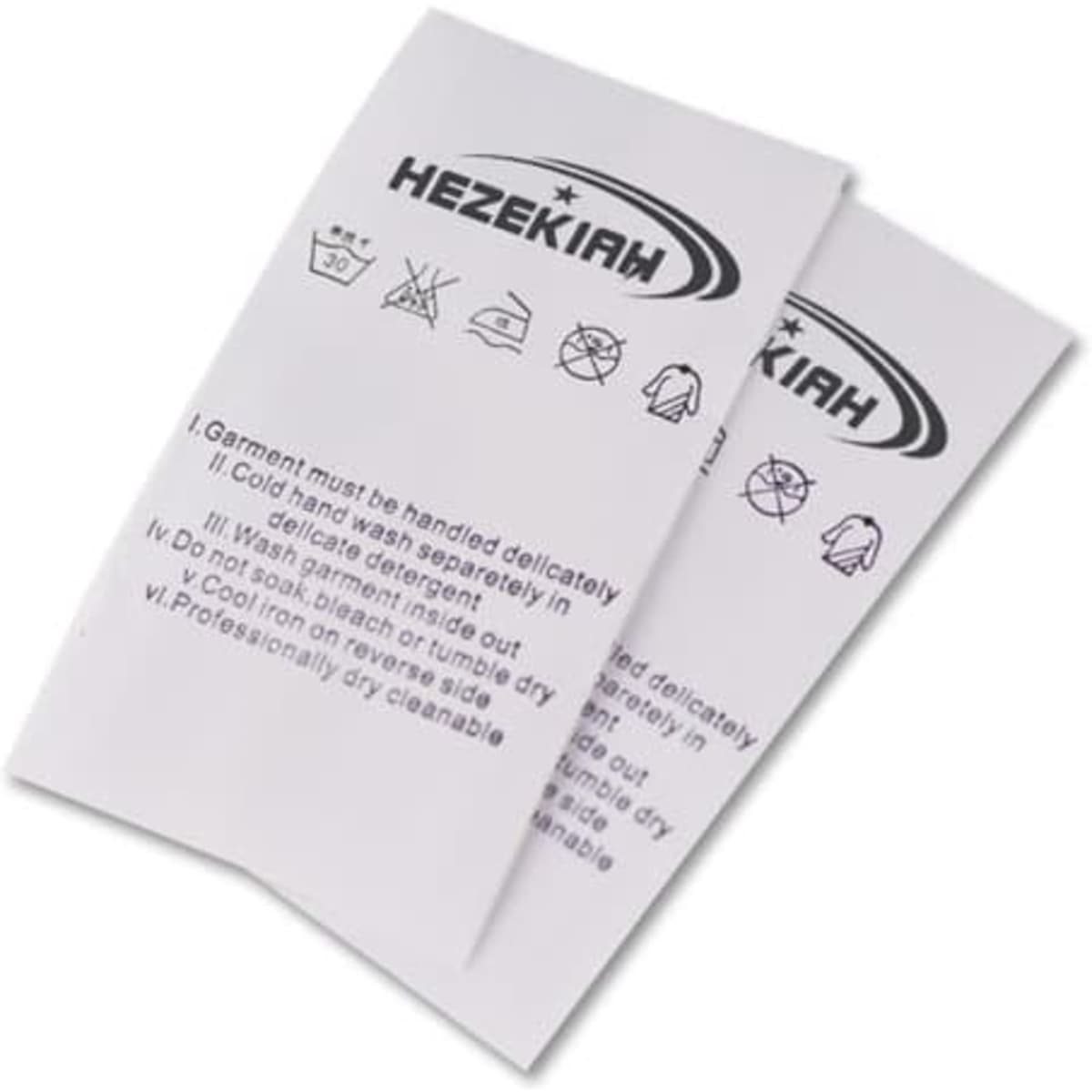 Two white clothing labels with care instructions and a logo. The labels feature icons for wash and care guidelines.