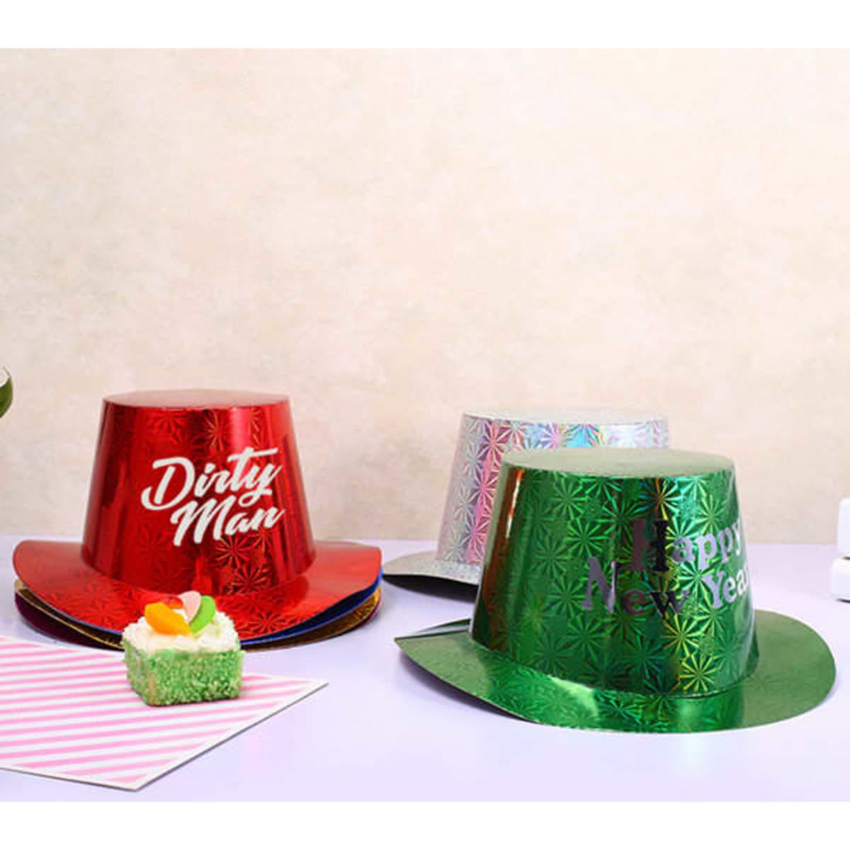 A set of three party top hats in red, silver, and green with decorative patterns. Each hat has a logo.