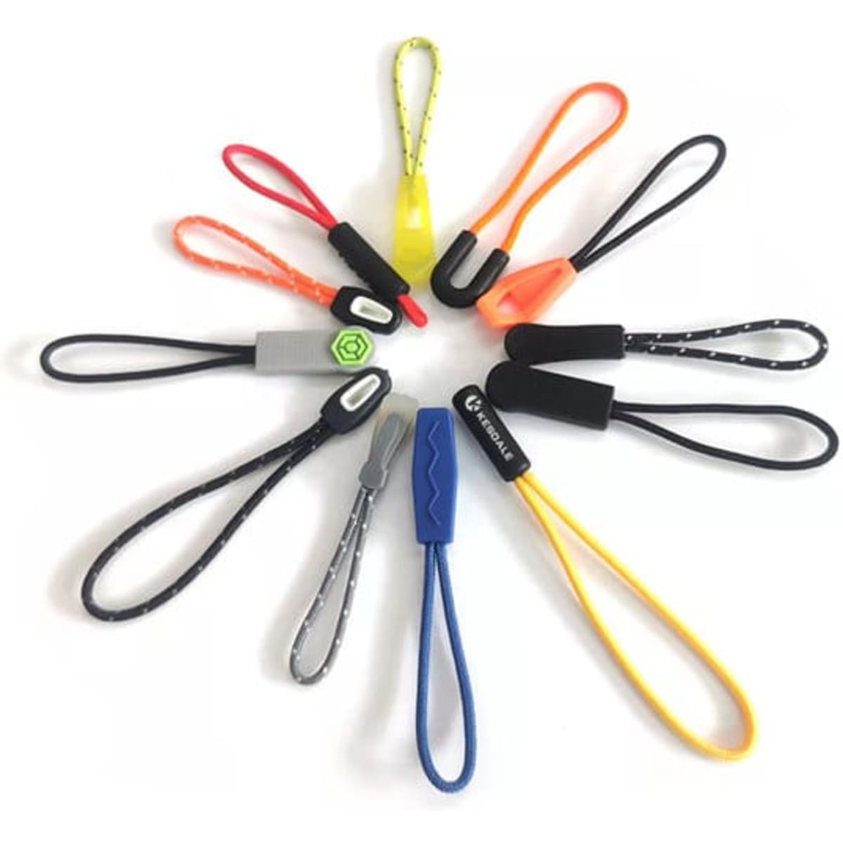 A collection of customised plastic zipper pullers in various colours, featuring different designs and a logo on some.