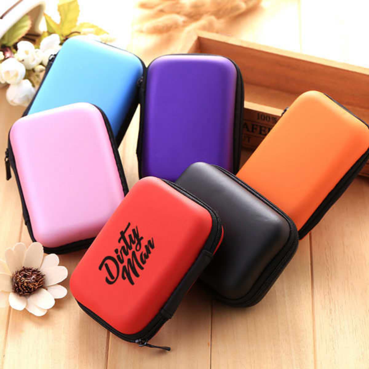 A collection of portable EVA hard carry cases in red, purple, blue, pink, orange, and black with a logo.