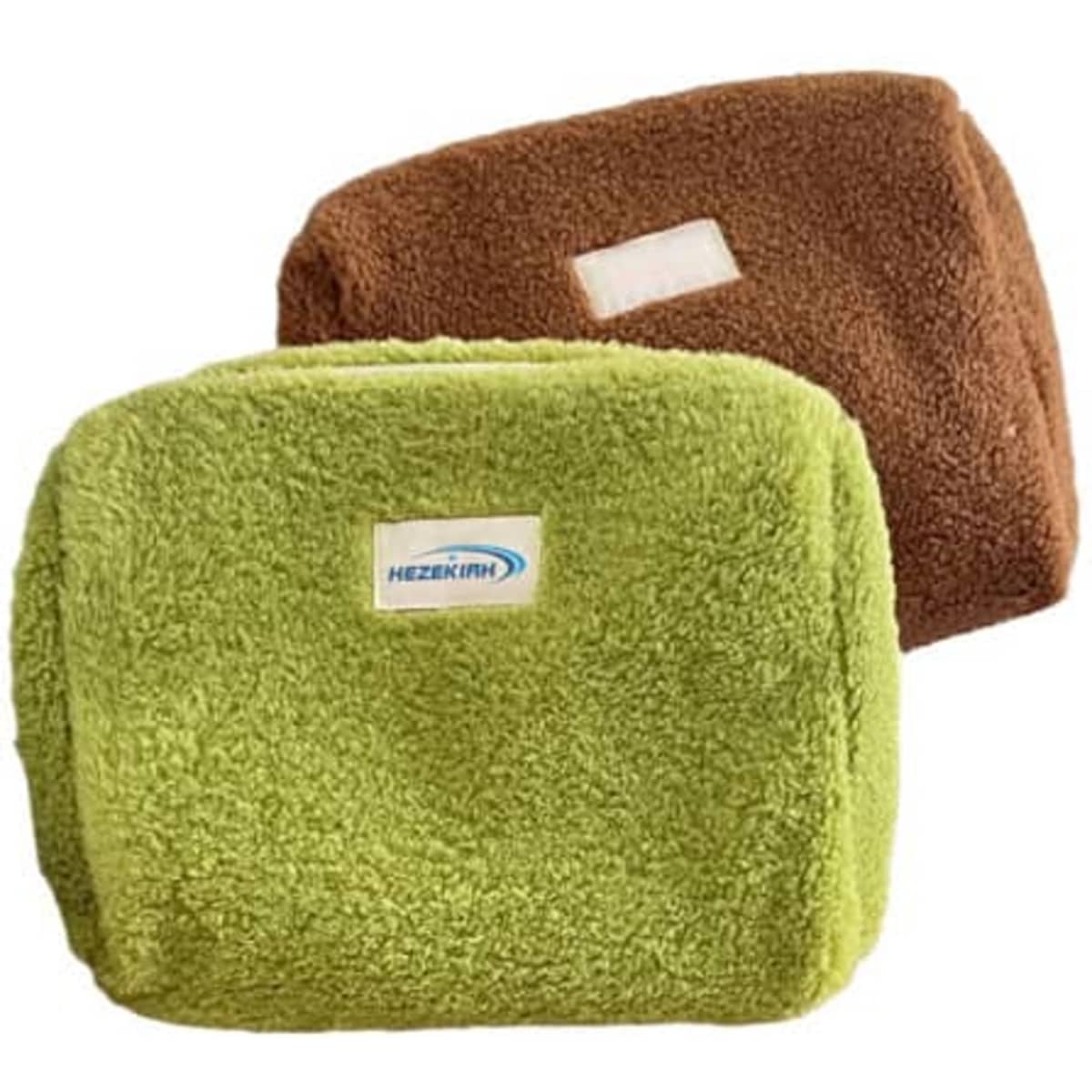 A green and brown lamb wool cosmetic bag with a label, featuring a textured, soft appearance.