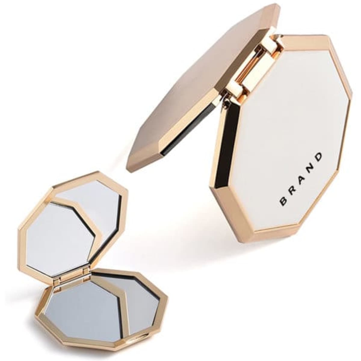 A double-sided travel makeup mirror with an octagonal shape, featuring a gold frame and a white surface.