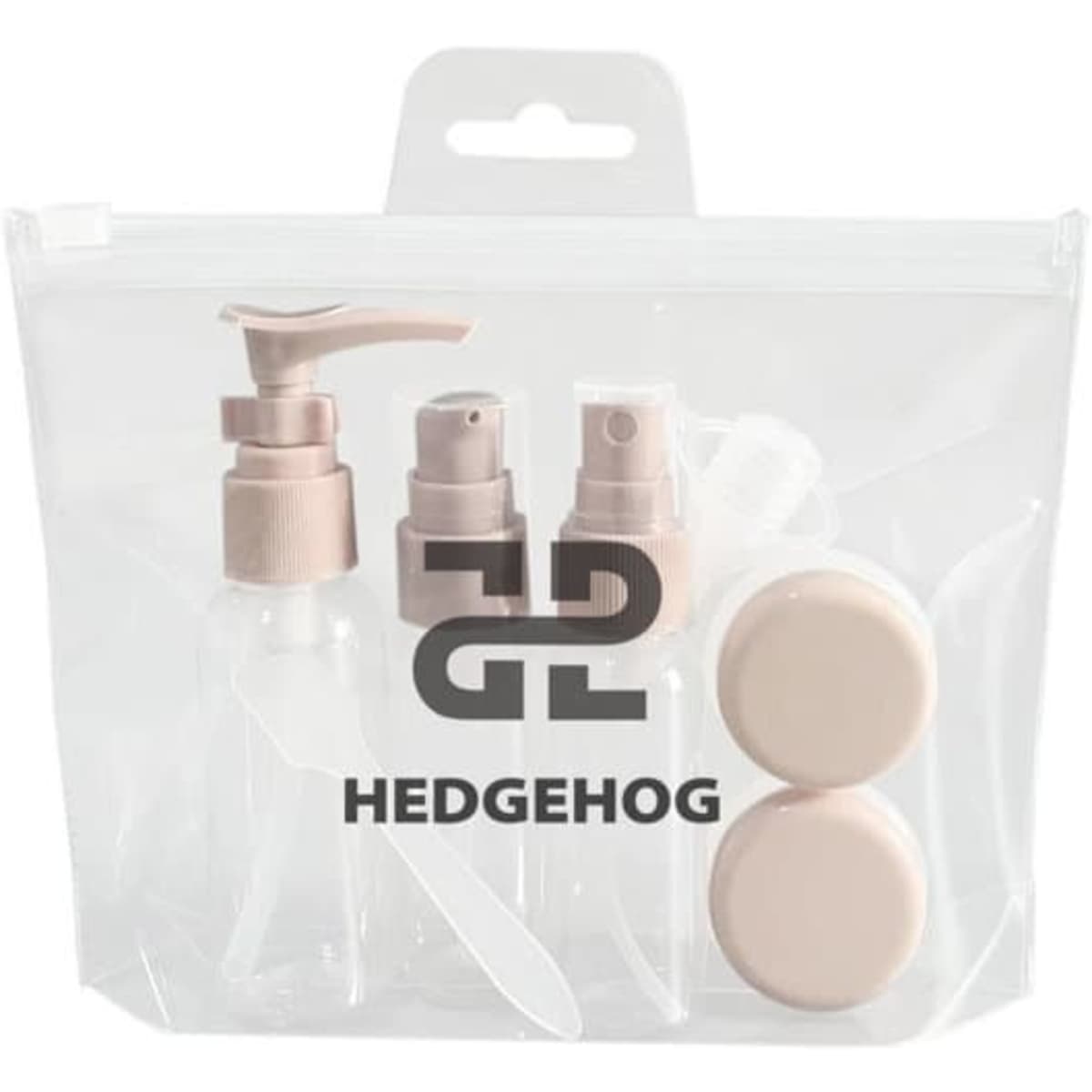 A clear toiletry bag containing four small, beige travel bottles and two containers. The bag features a logo.