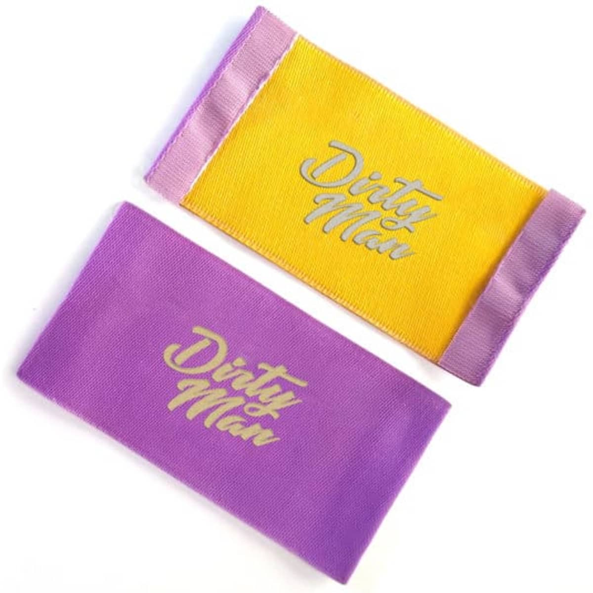 Two custom woven labels in yellow and purple, featuring a logo in a stylish font on each label.