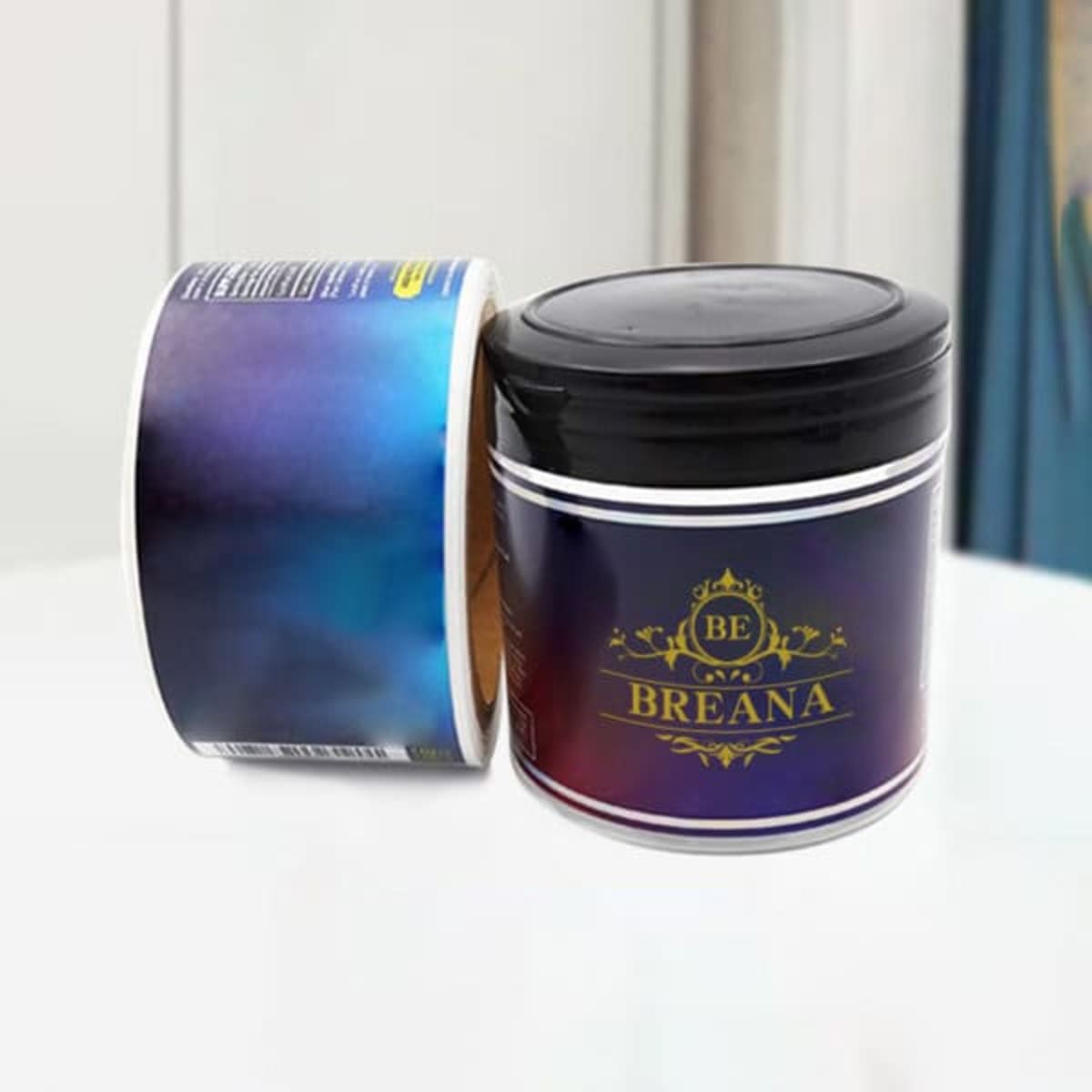 A round container with a black lid, featuring a gradient blue and purple design, and a logo on the front.