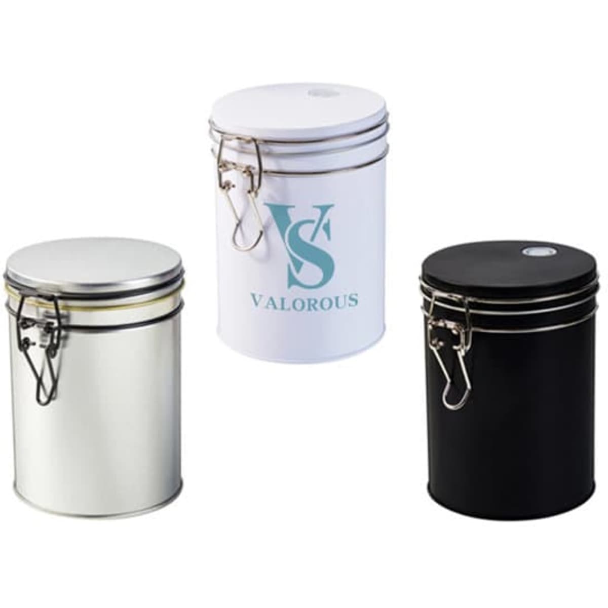 Three tinplate coffee containers in black, white, and metallic silver, each with a secure lid and branding.