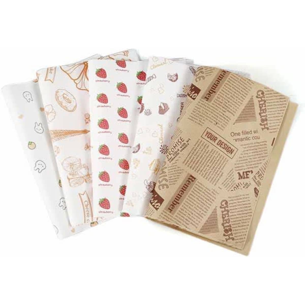 Various sheets of custom wrapping paper featuring patterns, including strawberries and playful illustrations, with a brown paper design.