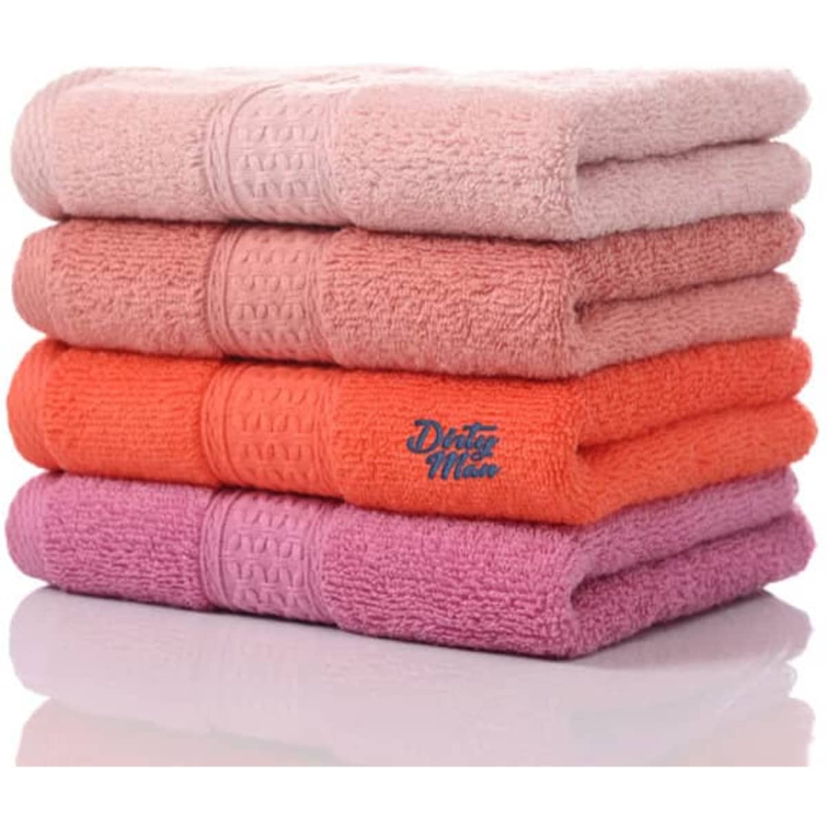 A stack of large absorbent cotton bath towels in pink, orange, and purple hues, featuring a logo on one towel.