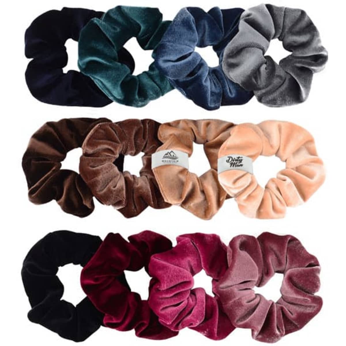 A variety of soft velvet scrunchies in deep green, navy, brown, light pink, dark pink, black, and burgundy.