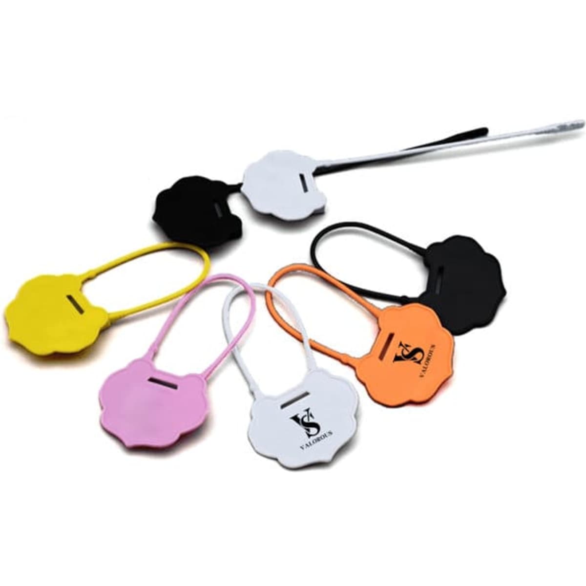 A collection of plastic tamper security seals in various colours including yellow, pink, black, orange, and white, arranged together.
