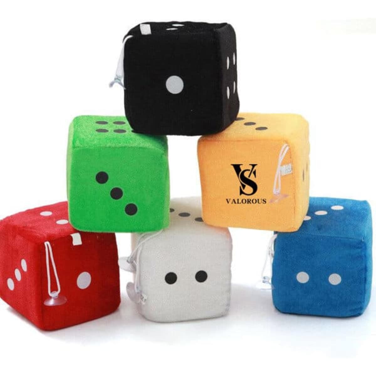 Colourful fuzzy dice in black, green, yellow, blue, white, and red, stacked with a logo on one die.