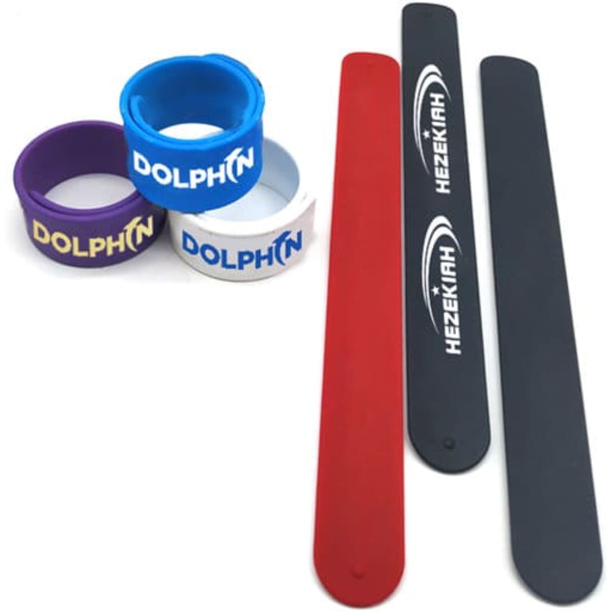 A selection of silicone slap bracelets in red, black, blue, purple, and white featuring branding.