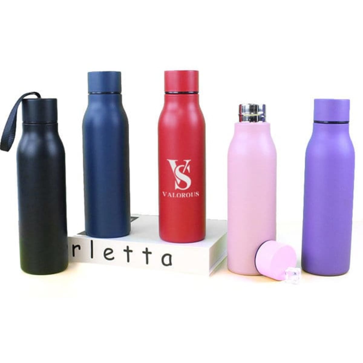 A drink bottle display featuring stainless steel vacuum insulated bottles in pink, black, navy, red, and purple, with various logos.