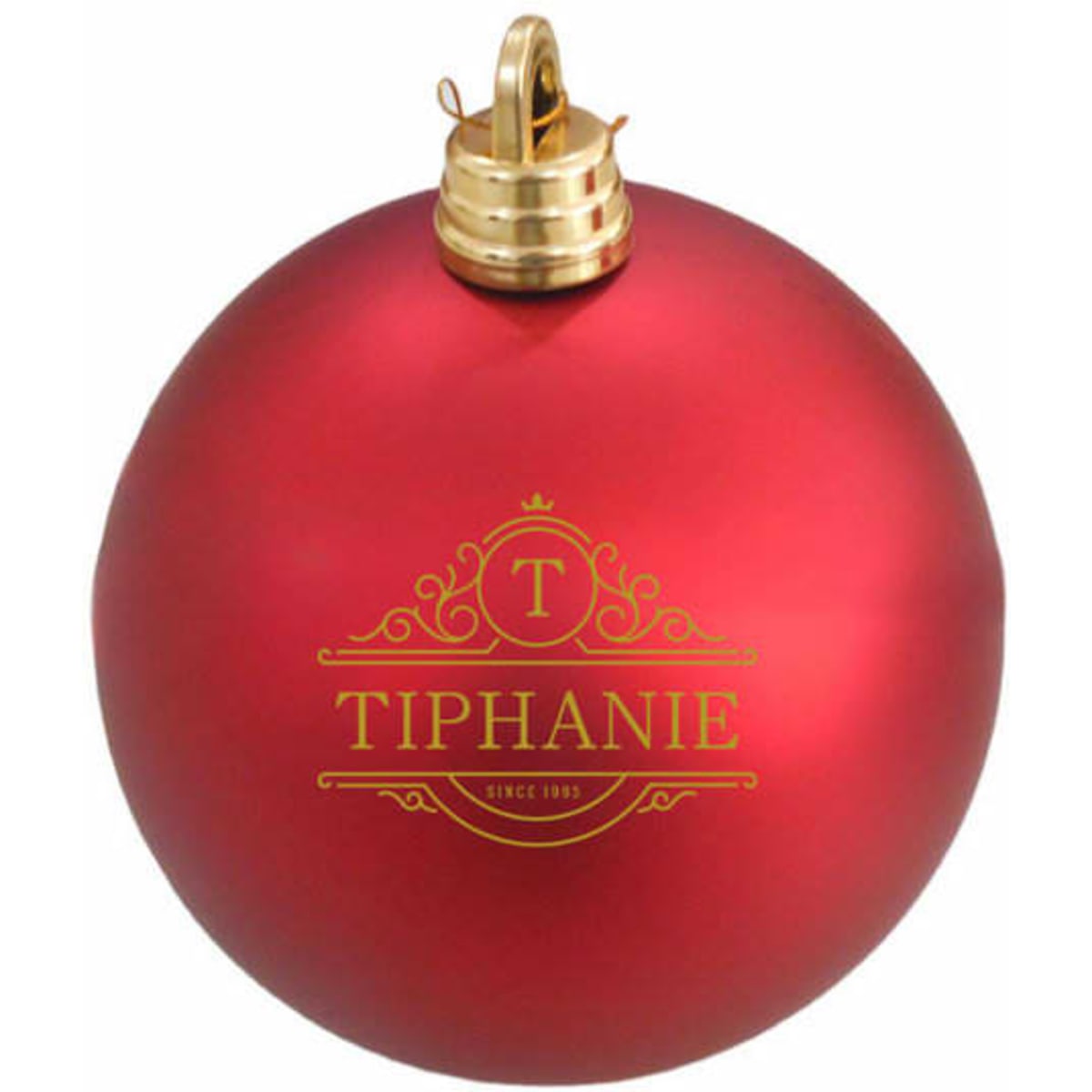 A shiny red Christmas tree ball with a gold decorative logo and a golden top attachment.
